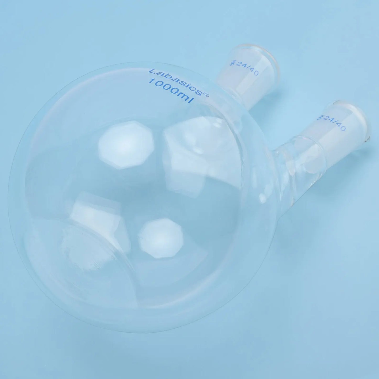 Flat bottom detail of 2 neck borosilicate glass flask, stable base design