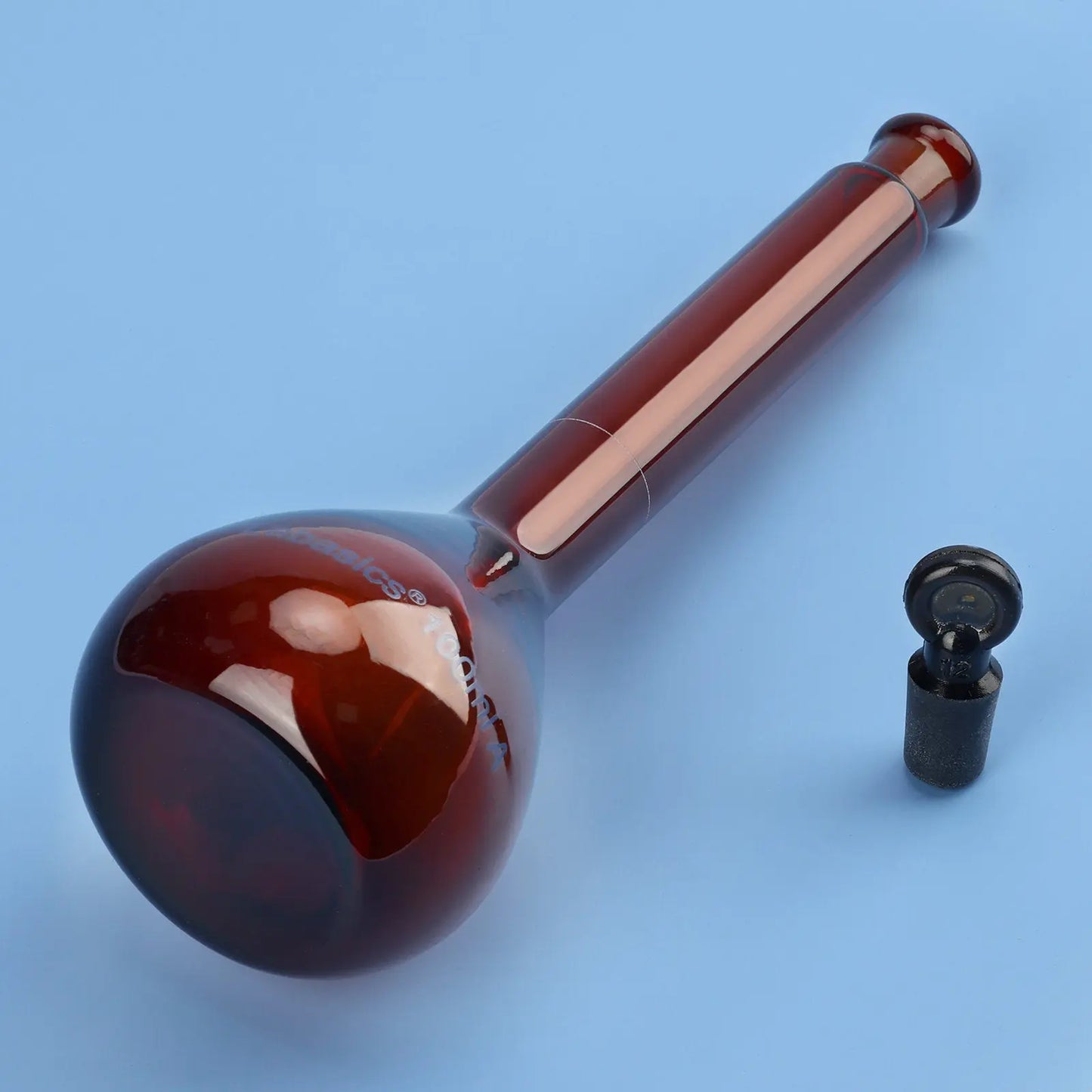Close-up of leak-proof frosted mouth and stopper on 100 ml amber volumetric flask