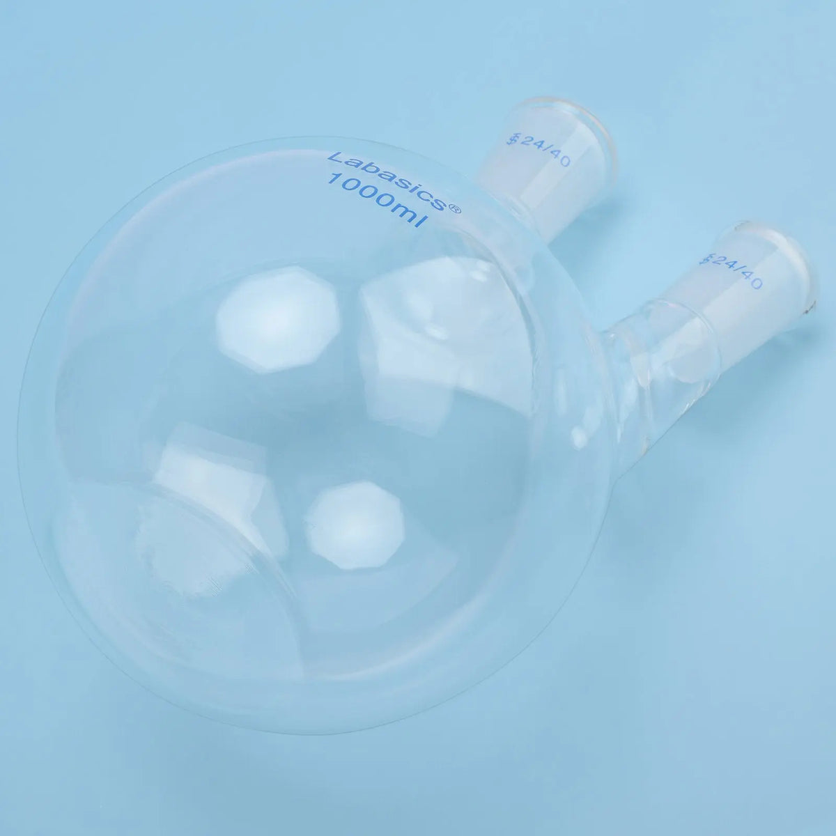 Flat bottom detail of 2 neck borosilicate glass flask, stable base design