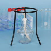 Black metal laboratory tripod positioned over a burner for heating applications