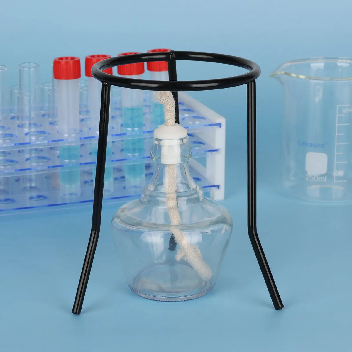 Black metal laboratory tripod positioned over a burner for heating applications